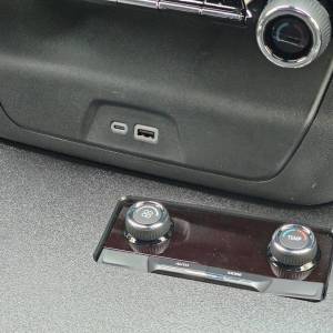 Factory USB/USB-c plugs and center seat A/C control module relocated to faceplate